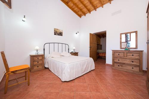 En eller flere senge i et værelse på Casa Rural Tadia