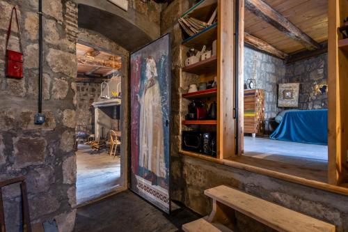 a room with a window and a view of a bedroom at Inter Artes Prestige House and Luxury Suite in Viterbo
