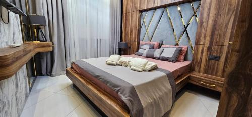a bedroom with a bed with two towels on it at Serenity SPA ALL-IN apartment Luxury resort private beach in Alanya