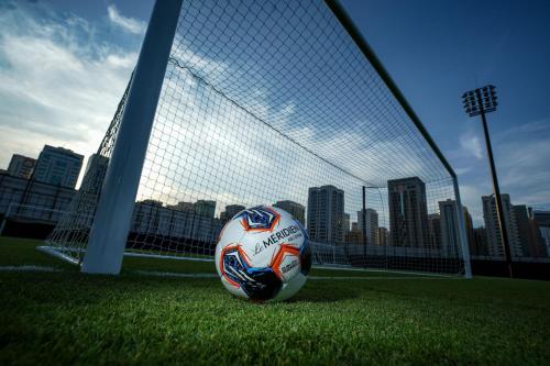 a soccer ball sitting in front of a goal at Le Meridien Abu Dhabi Resort in Abu Dhabi