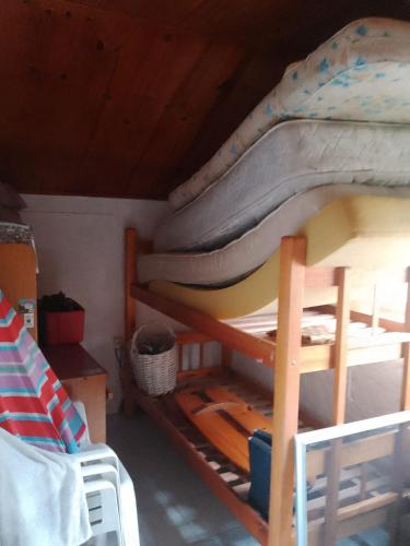 a bunk bed with a mattress on top of it at Alvaro in Aguas Dulces