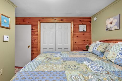 a bedroom with a bed and a white door at Lakeview Retreat in Lakeville