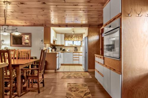 a kitchen and dining room with a table and chairs at Lakeview Retreat in Lakeville