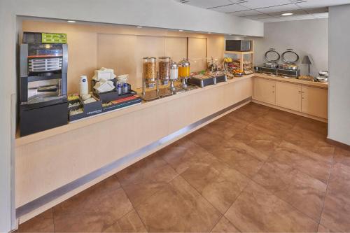 a large kitchen with a long counter in a room at City Express by Marriott Apizaco in Apizaco