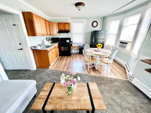 a living room with a table and a kitchen at Entire Lovely 3 Bedroom, 2 Bathroom Apartment! 1 Block to the Beach and Boardwalk! in Wildwood