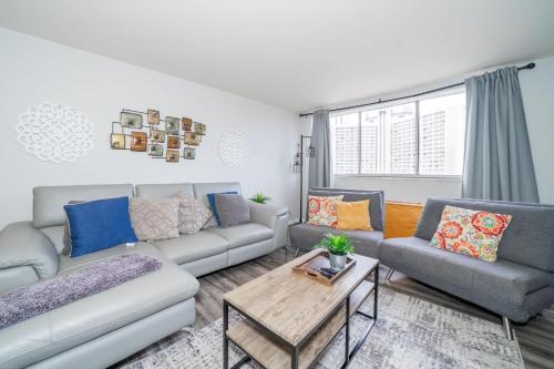 a living room with a couch and a table at Welcoming Barn, 2 BEDROOM & 1 Bath & Parking in Atlanta