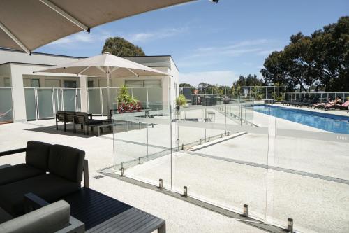 a house with a swimming pool and a patio at Walkerville Bliss in Adelaide