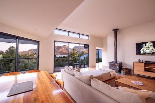 a living room with a couch and a table at The Bolthole in Coles Bay