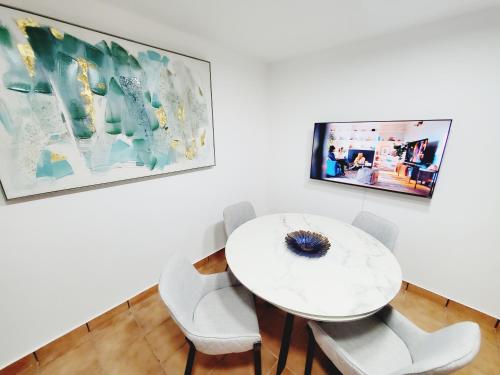 A television and/or entertainment centre at 3 Bedroom Luxury Apartment in San Juan