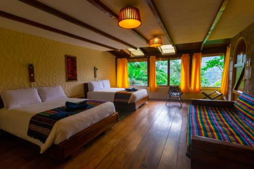 Postel nebo postele na pokoji v ubytování Bellavista Cloud Forest Lodge & Private Protected Area