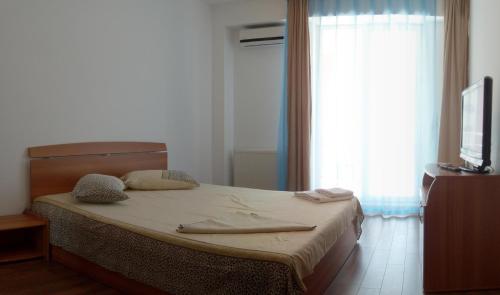 En eller flere senge i et værelse på Summerland Mamaia