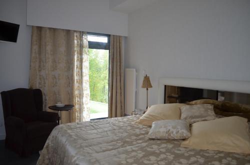 מיטה או מיטות בחדר ב-Casa de Campo de SOUTELO