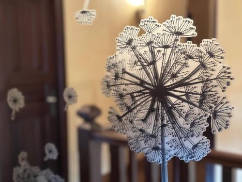 a flower in a vase in a room at O toxal in Monforte de Lemos