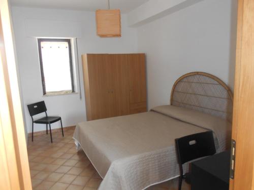 Säng eller sängar i ett rum på Casa Il Gelsomino