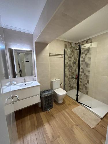 a bathroom with a sink and a toilet and a shower at Alojamento Cabeço de Vide in Cabeço de Vide