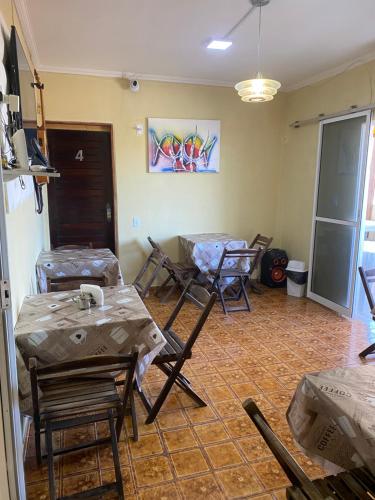 a room with tables and chairs wrapped in plastic at Pousada Atlântico Vista-Mar in João Pessoa