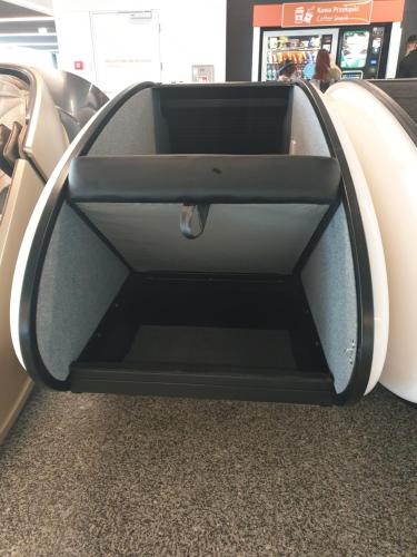 an open trunk of a car at an airport at Sleeping Pods GoSleep - Inside of Warsaw Chopin Airport, non schengen restricted zone after passport control, near Gate 2N in Warsaw