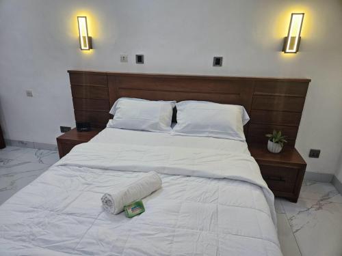 Tempat tidur dalam kamar di Studio Le Cosi, Cotonou