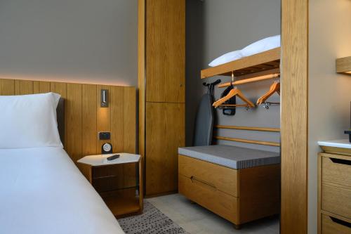 a bedroom with a bed and a bunk bed at Crowne Plaza Hobart by IHG in Hobart