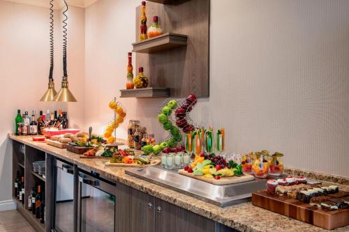 a buffet line with many different types of food at Delta Hotels by Marriott Regina in Regina