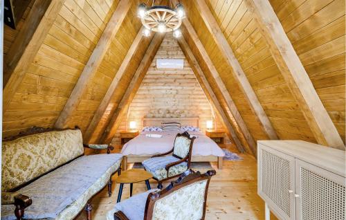 a bedroom with a bed in a wooden attic at Pet Friendly Home In Petrinja With Wi-fi in Petrinja