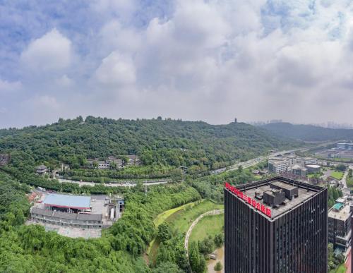 an aerial view of a building with red ribbon at Wuyu Hotel - Chongqing Liangjiang Happiness Plaza & Xingfu Square & GuangdianYuan metro in Chongqing
