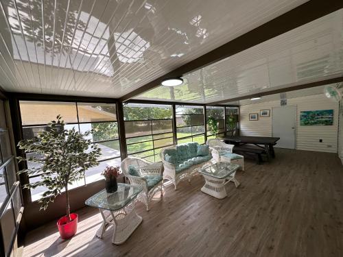 a living room with a couch and a table at Waterfront Canal in Satsuma Florida in Satsuma