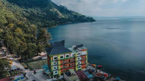 an aerial view of a building next to a body of water at Agape Hotel Haranggaol in Haranggaul