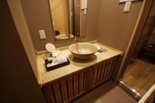 Koupelna v ubytování 京ごはんと露天風呂の宿 ゆのはな 月や