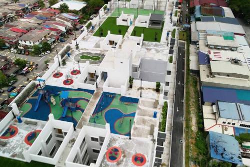 an aerial view of a building with a swimming pool at CANA Homestay Petaling Jaya in Petaling Jaya