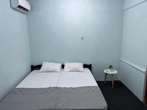 Postel nebo postele na pokoji v ubytování Faire BNB Homestay