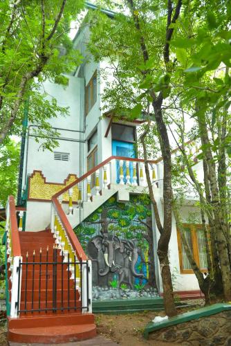 a building with a mural of an elephant on it at Spice Village Hotel & Restaurant in Habarana