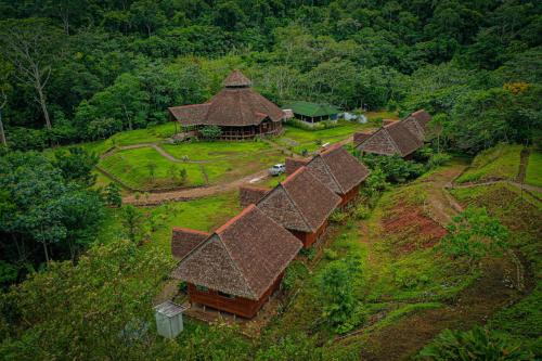 an overhead view of a group of huts on a hill at Kotsimba Lodge in Puerto Leguía