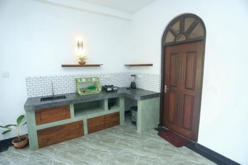 Η κουζίνα ή μικρή κουζίνα στο villa Breezehaven