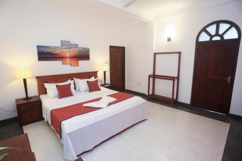 Ένα ή περισσότερα κρεβάτια σε δωμάτιο στο villa Breezehaven