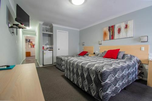 Postel nebo postele na pokoji v ubytování Gundagai Motel