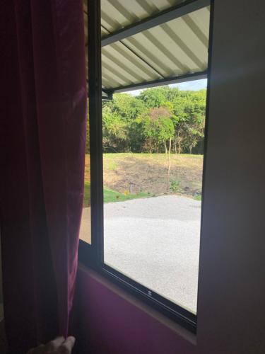 a window in a room with a view of a driveway at Casa Zion in San Juanillo