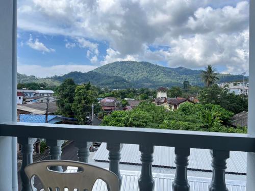 a balcony with a view of a mountain at AB House in Ban Thung Thong