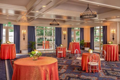 a conference room with red tables and chairs and windows at The Westin Riverwalk, San Antonio in San Antonio