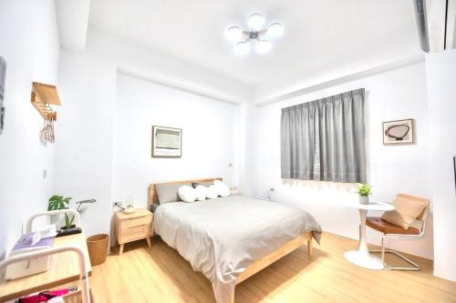 Cama o camas de una habitación en 山依民宿