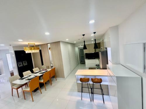 a kitchen and dining room with a table and chairs at SCENIC VALLEY 1 in Ho Chi Minh City