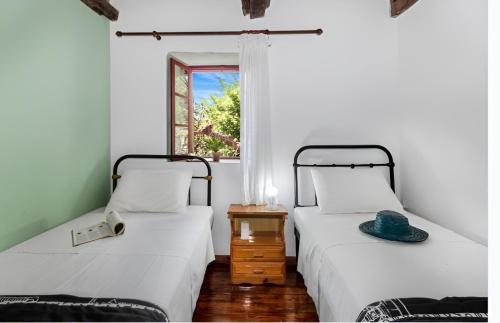 Katil atau katil-katil dalam bilik di Ellen traditional House
