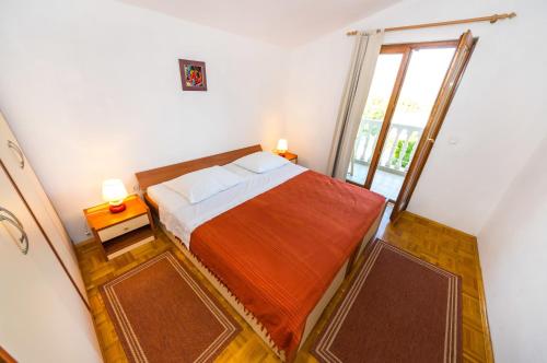 Ένα ή περισσότερα κρεβάτια σε δωμάτιο στο Apartments Jagoda