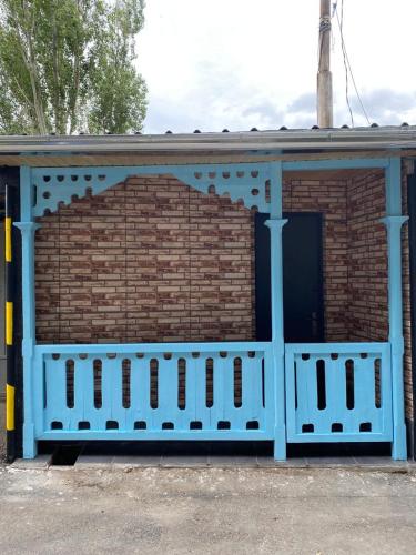 a building with a blue door and a brick wall at Garage Hotel - Old Tbilisi in Tbilisi City