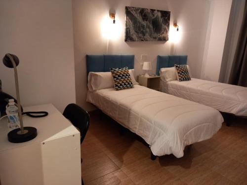 Katil atau katil-katil dalam bilik di HOTEL LOS CAÑAS
