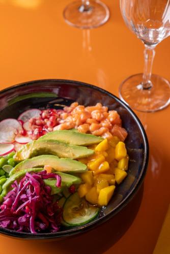 a plate of food on a table with a salad at voco Paris - Porte de Clichy by IHG in Clichy