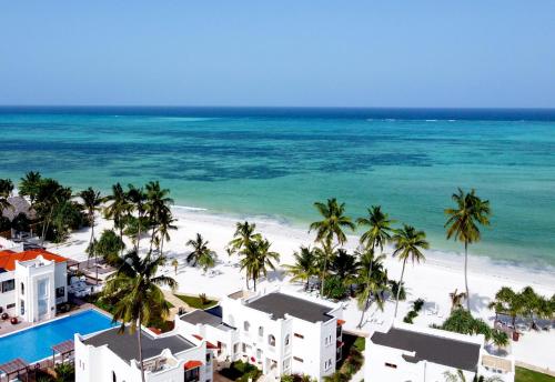 an aerial view of a beach with palm trees and buildings at LUX* Marijani Zanzibar in Pwani Mchangani