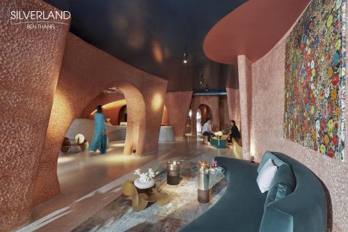 a rendering of a lobby with a couch and people at Silverland Bến Thành in Ho Chi Minh City