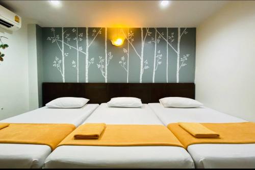 Postel nebo postele na pokoji v ubytování Phang Nga Guesthouse