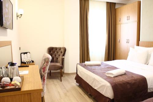 Melidium Hotelにあるベッド